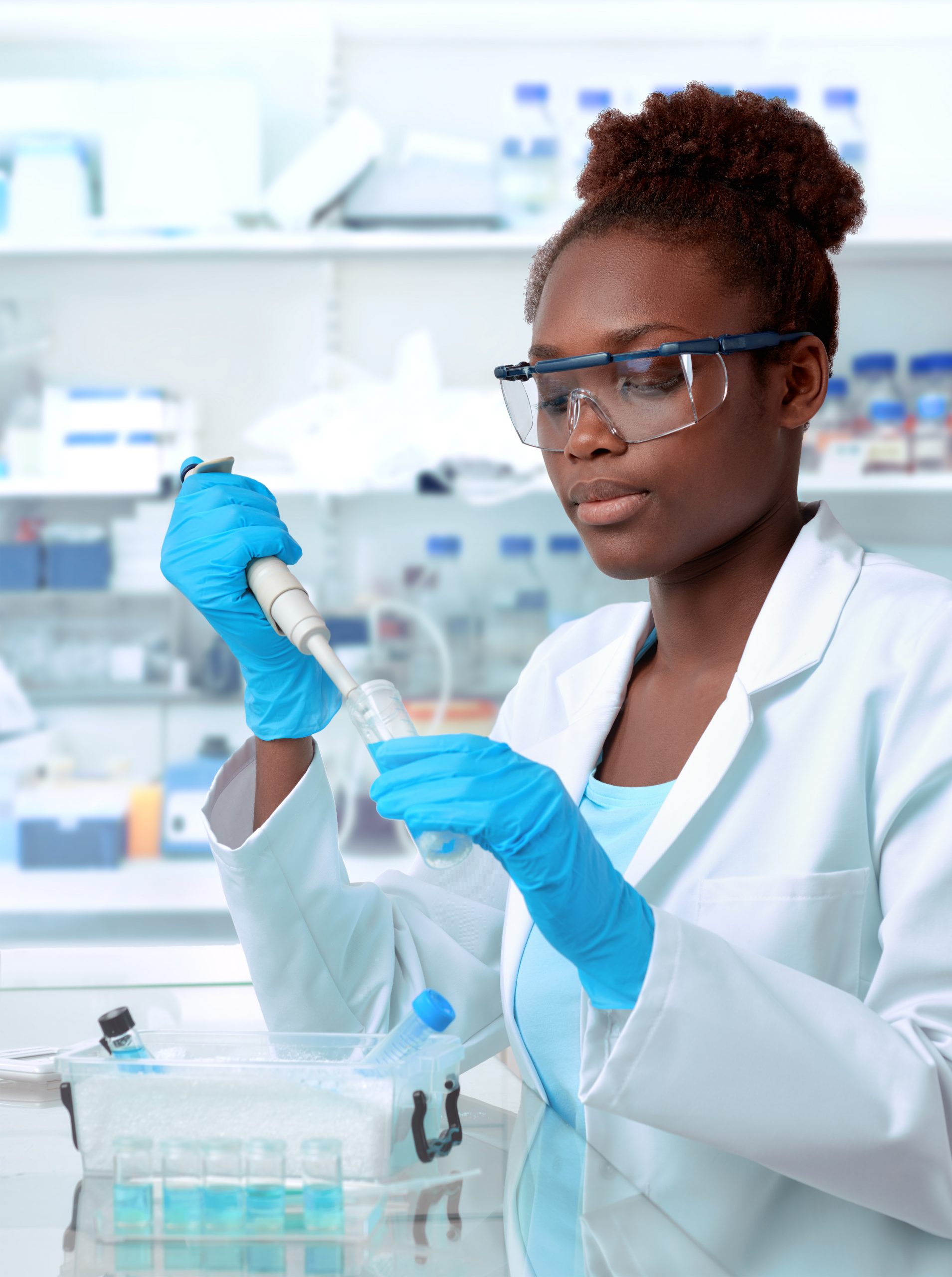 black female scientist with test tubes