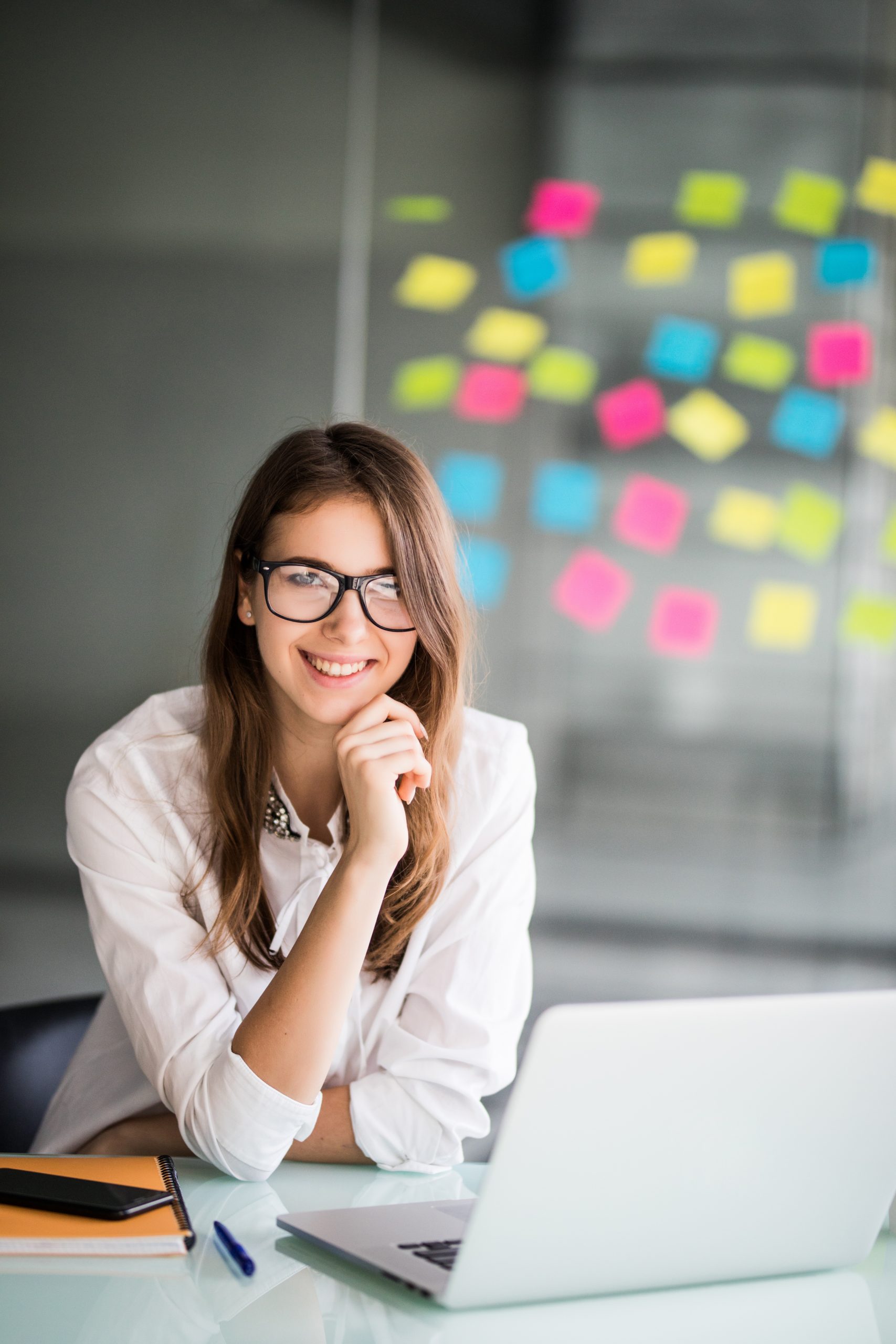 Caucasian female smiling at computer