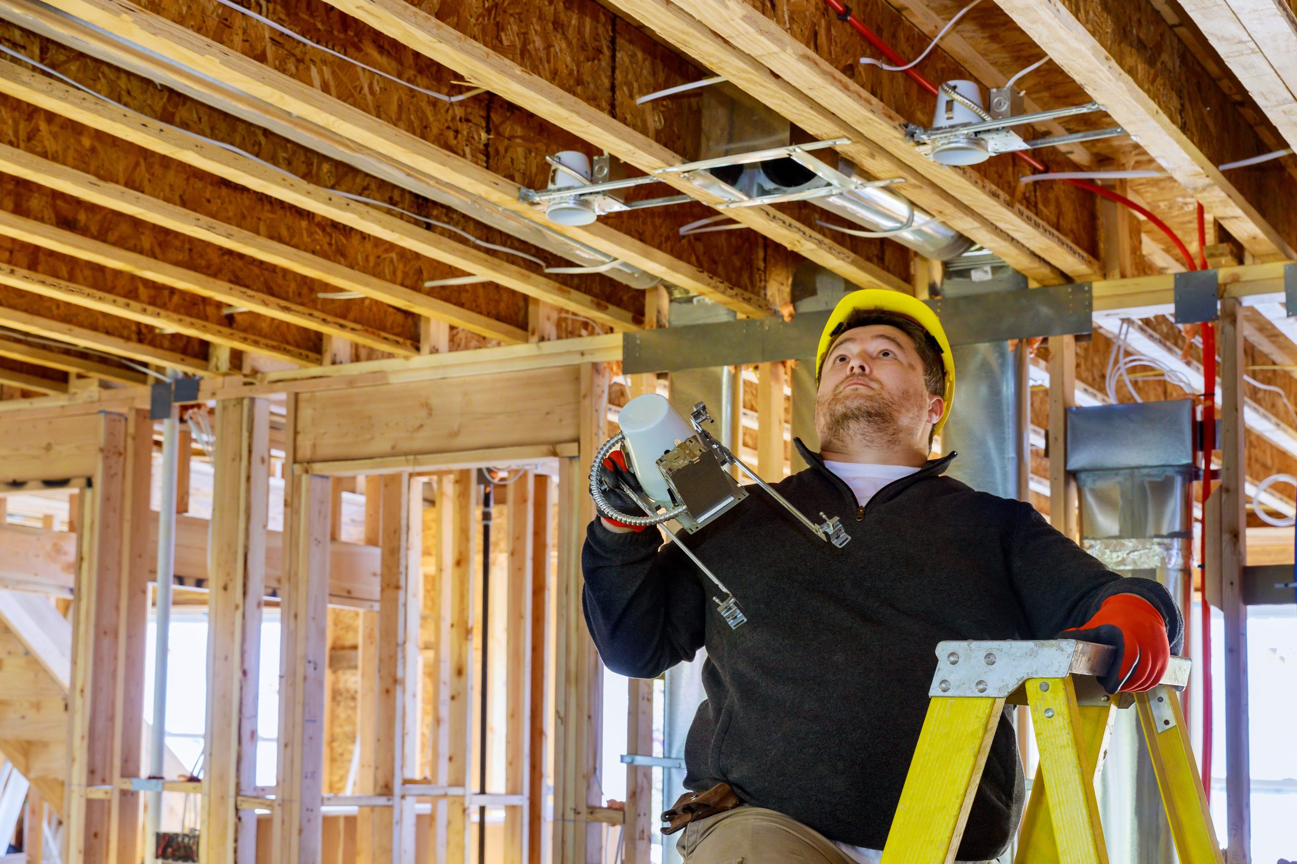 Installation of electrical for light bulb on a hanging ceiling lamp