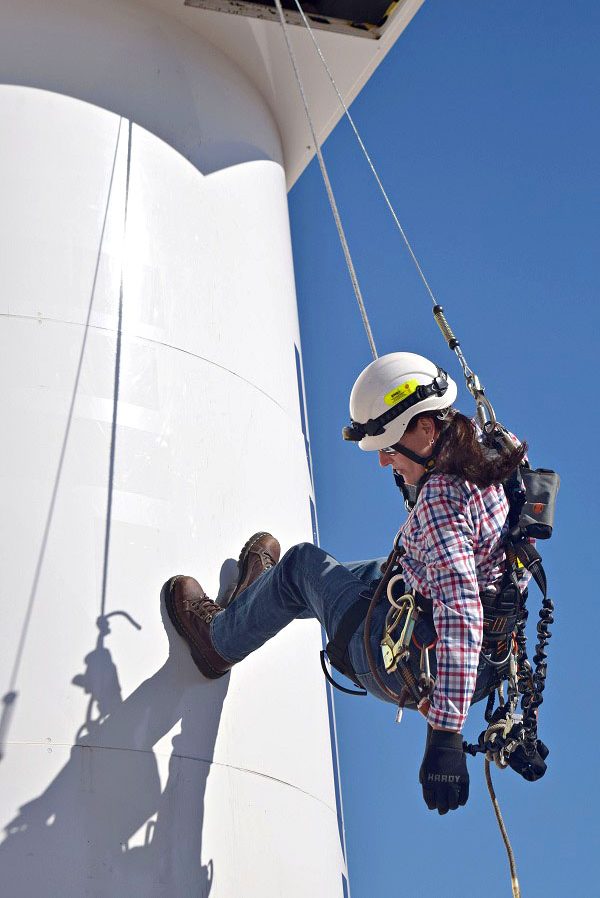 Female Wind Energy Technician in action