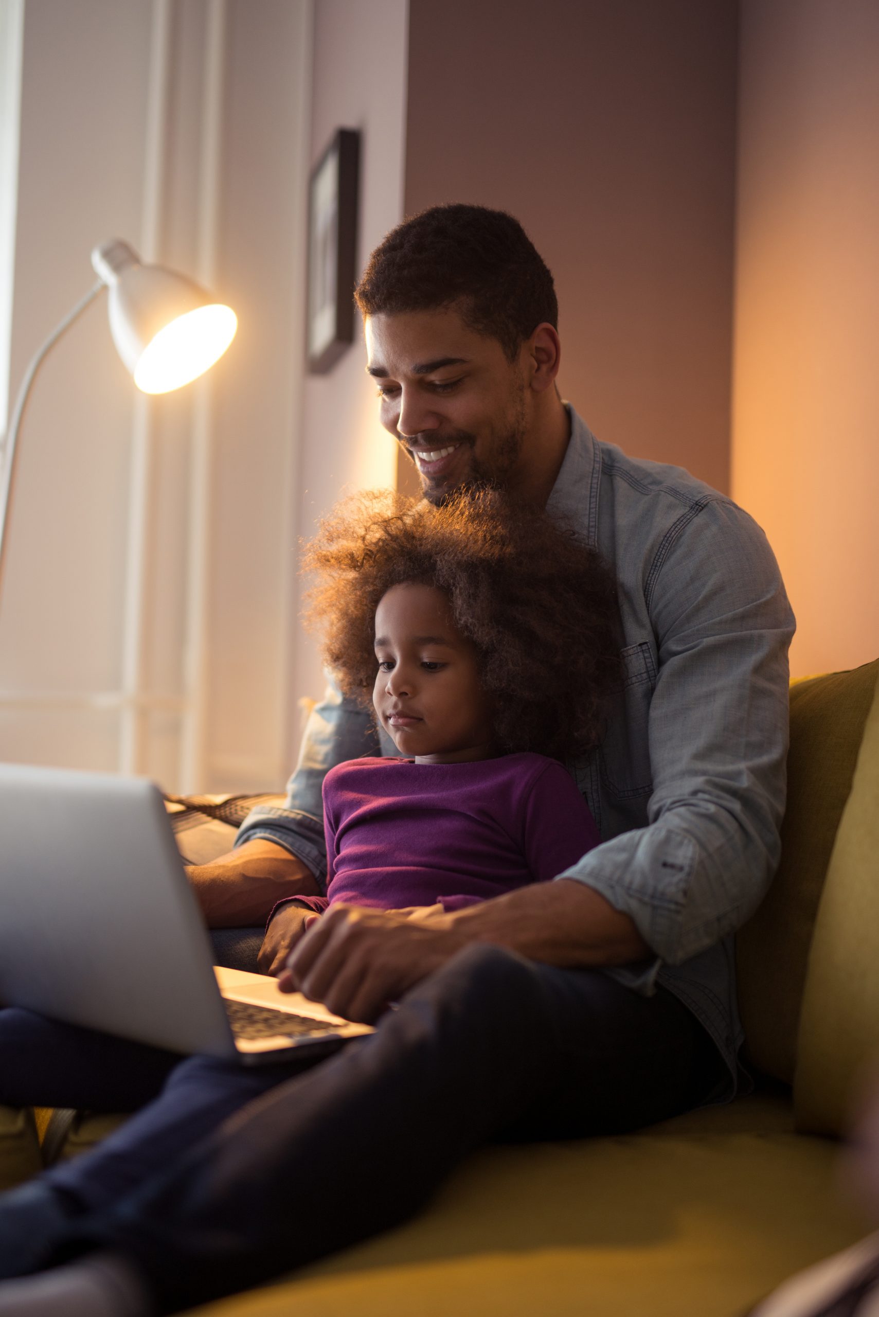 Black male with daughter on laptop | Adult Learners