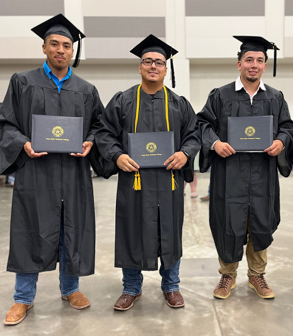 A four male graduates posing at the Summer 2024 commencement ceremony in Waco, Texas.