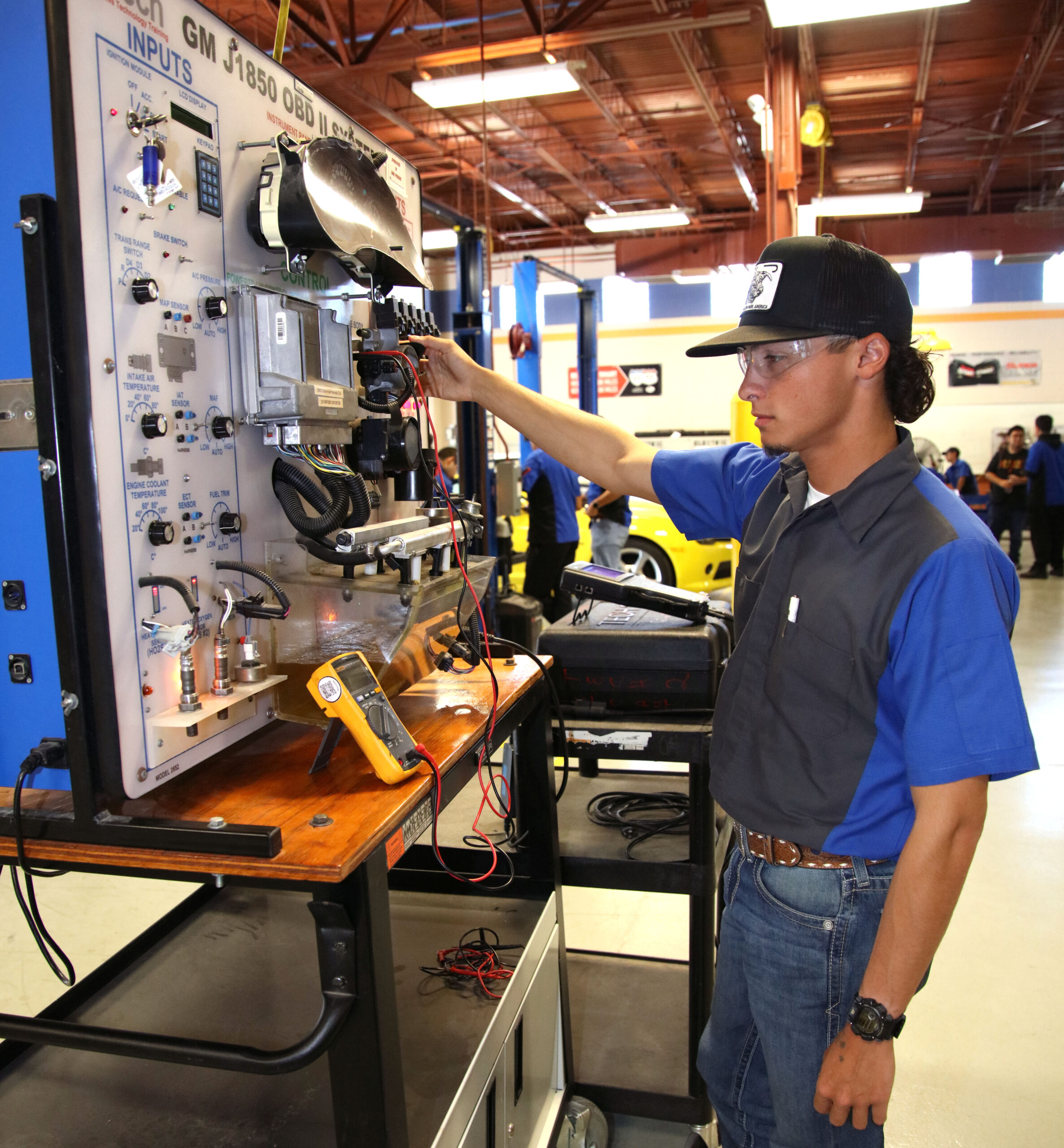 TSTC Automotive Technology student Nathan Weaver monitors the voltage in a throttle body using an automotive vehicle trainer during a recent lab session.