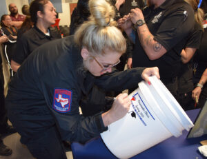 EMS signing bucket 300x231 - TSTC Emergency Medical Services program’s past revealed when time capsule opened