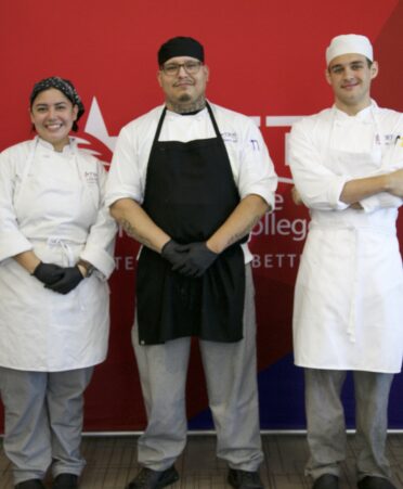 three chefs standing together
