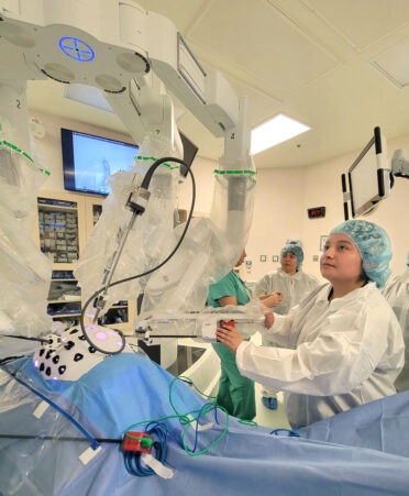 TSTC Surgical Technology student Jasmine Villanueva (right) controls a robotic arm on the da Vinci Xi surgical system during a recent one-day training session at Valley Regional Medical Center.
