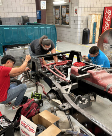 (Left to right) TSTC Auto Collision and Management Technology students Emiliano Benitez, Christian Esparza and Dominick Zavala work on a suspension overhaul during a recent lab session.