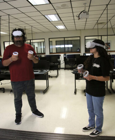 TSTC Drafting and Design students Jacob Bocanegra (left) and Alejandra Sanchez explore the Meta Quest 2 virtual reality that the program will incorporate into the curriculum next fall.