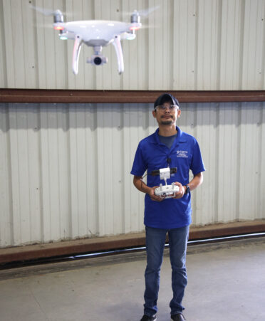 Edgar Flores, a Remote Drone Pilot instructor with TSTC’s Workforce Training and Continuing Education department, uses a remote-control device to maneuver a drone.