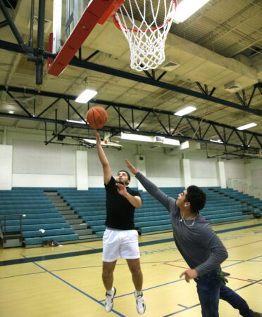 TSTC Electrical Lineworker and Management Technology students Angel Hernandez (left) and Santana Sanchez play basketball at TSTC’s Wellness and Sports Center.