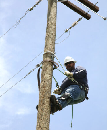 Benigno Galvan, a TSTC Electrical Lineworker and Management Technology student, climbs a pole that is intended to conquer a fear of heights during a recent lab session.