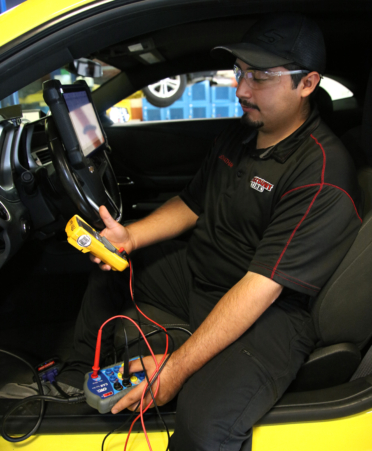 Jonathan Garza, an Automotive Technology student at TSTC’s Harlingen campus, does a diagnostic check on a 2015 Chevrolet Camaro during a recent lab session.