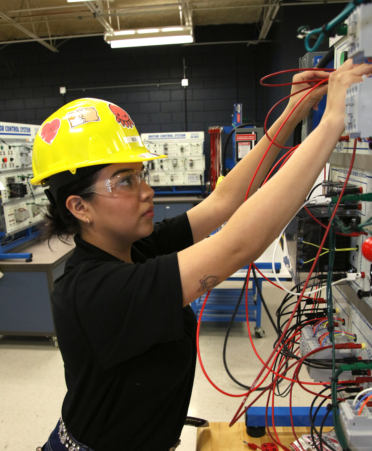 Mia Segueda, a Mechatronics Technology student at TSTC’s Harlingen campus, works on a motor controls assignment during a recent lab session.