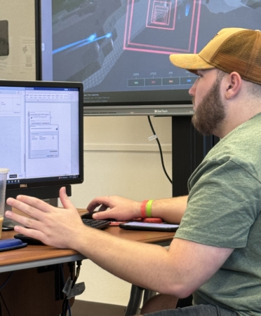 TSTC Computer Networking and Systems Administration student Henry Brown sits at a computer in a lab at East Williamson County Campus to work through class modules.