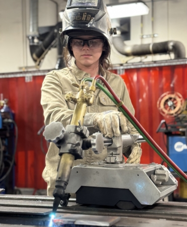 TSTC Welding Technology student Raya Rabold cuts material during a recent lab session. (Photo courtesy of TSTC.)