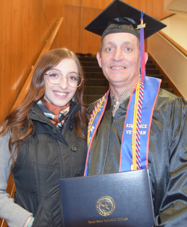 father and daughter at commencement