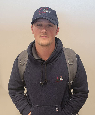 man in black jacket and baseball cap