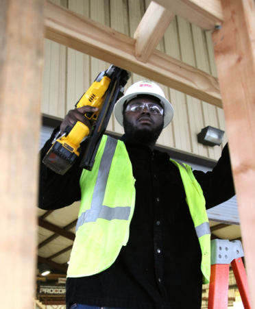 Kelon Orr, a Building Construction Technology student at TSTC’s Harlingen campus, frames the roof of a shed during a recent lab session.