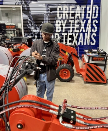 Robert Knox, a Diesel Equipment Technology student at TSTC’s Marshall campus, observes a skid steer hydrostatic trainer, one of the many new pieces of equipment at the campus’s new Diesel Technology Academic Building. (Photo courtesy of TSTC.)