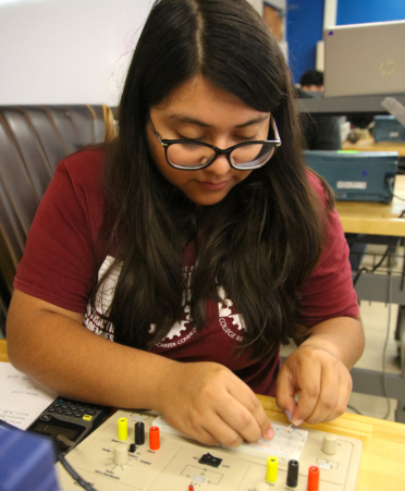 Alexis Rodriguez, a Biomedical Equipment Technology student at TSTC’s Harlingen campus, analyzes an alternating current circuit during a recent lab session.