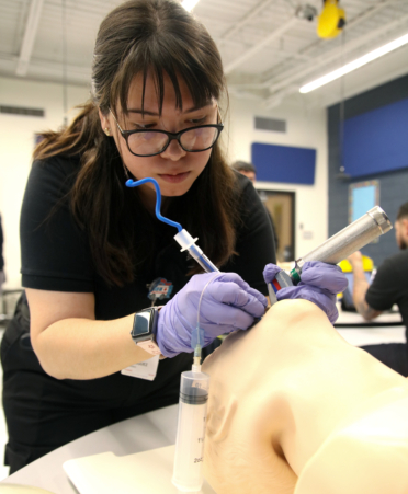 Jessie Rodriguez, a Paramedic student at TSTC’s Harlingen campus, trains for a procedure on a medical manikin during a recent lab session.