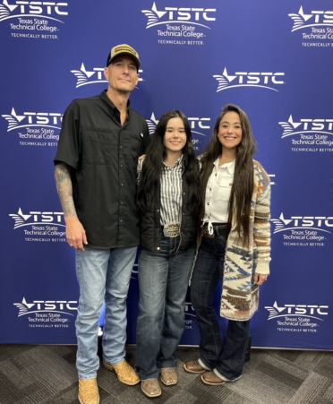 TSTC Welding Technology student Raya Rabold, center, stands with her parents Jarrod Rabold, left, and Rochelle Rabold, at TSTC’s East Williamson County campus.