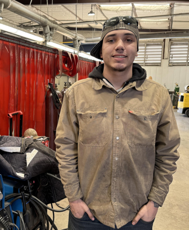 man in welding shirt inside a lab